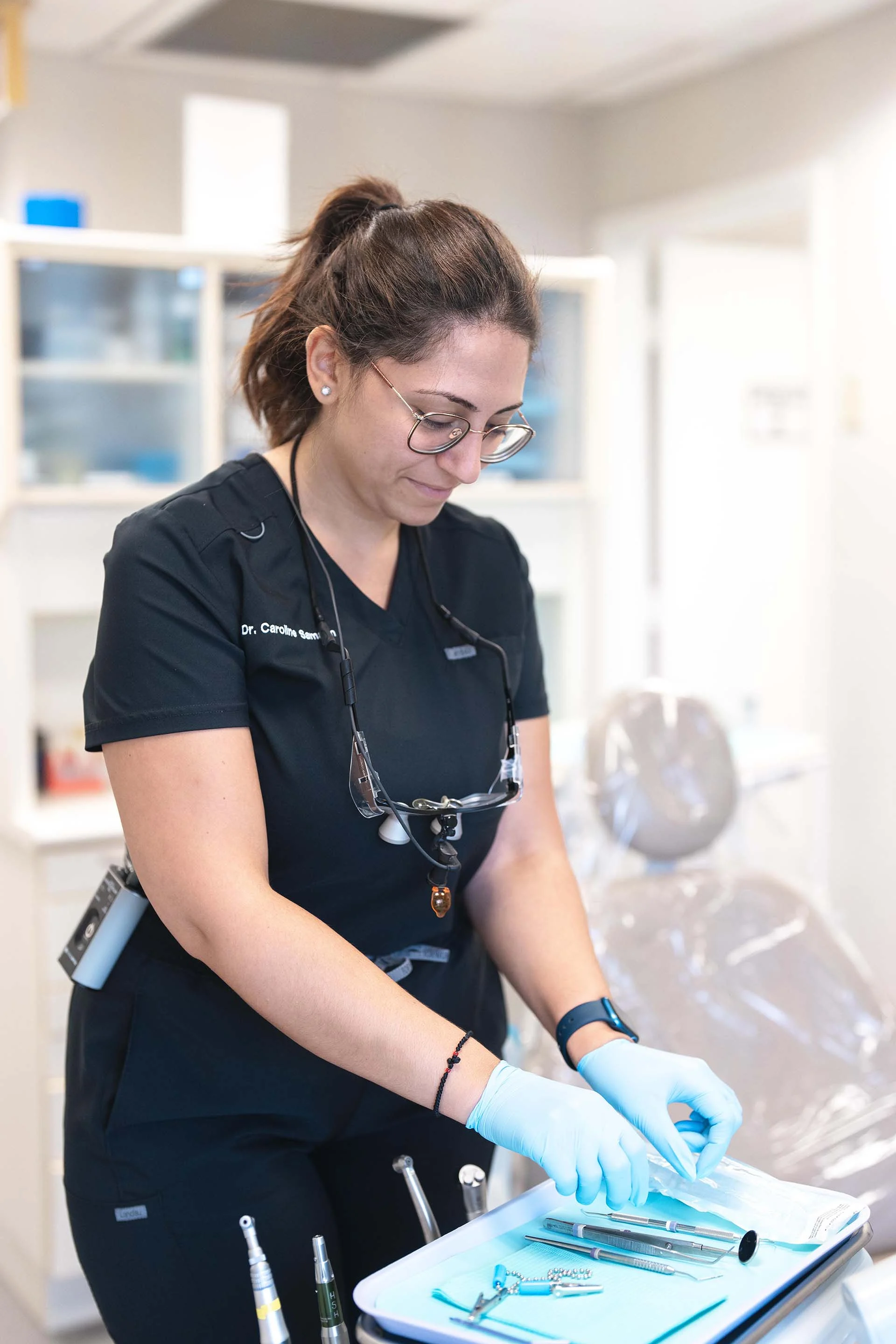 Dr Caroline Samaan getting ready at Seda Dental in Jupiter Florida