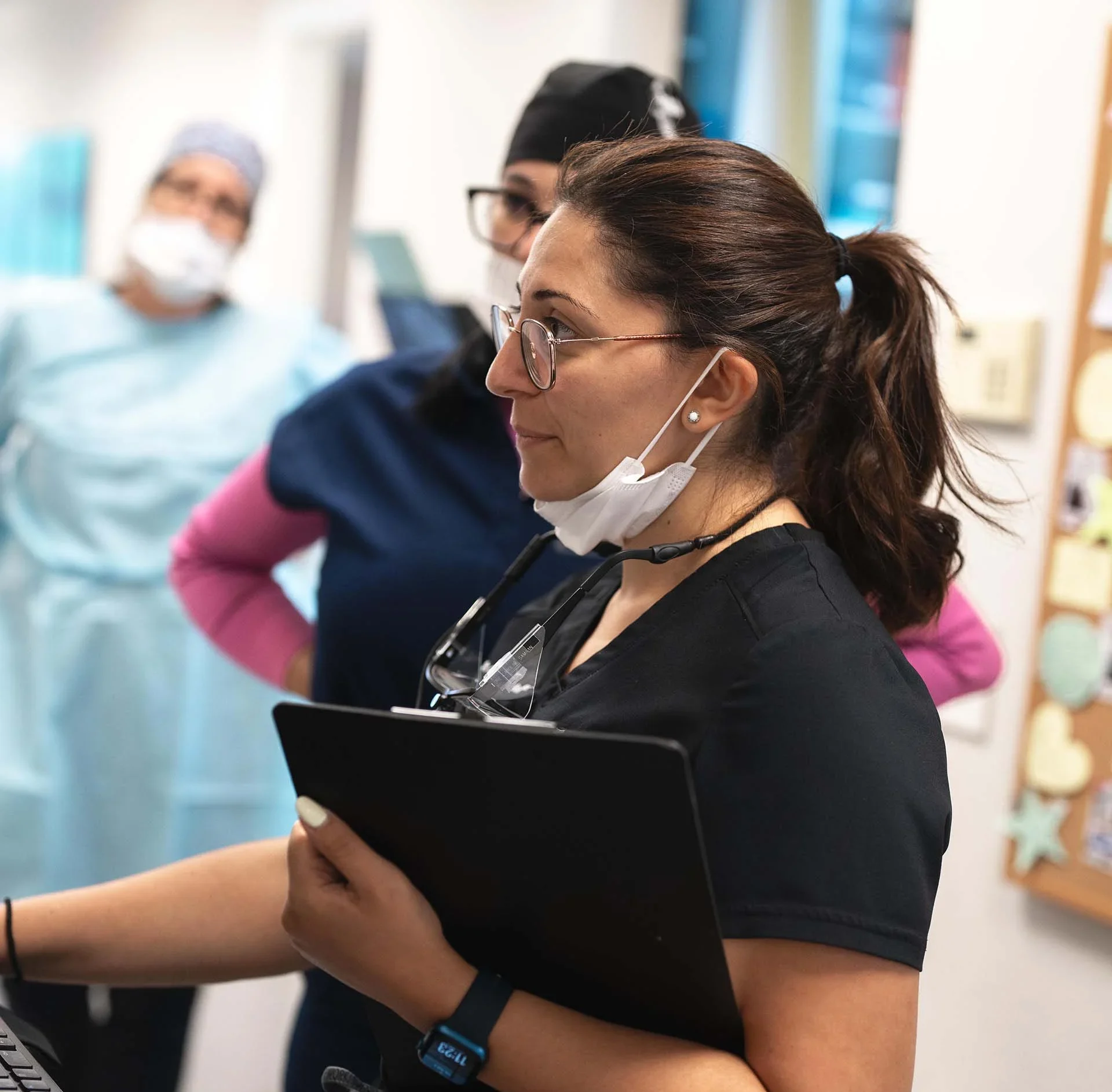 Dr Caroline Samaan looking at the dental implant case in Jupiter Florida Seda dental