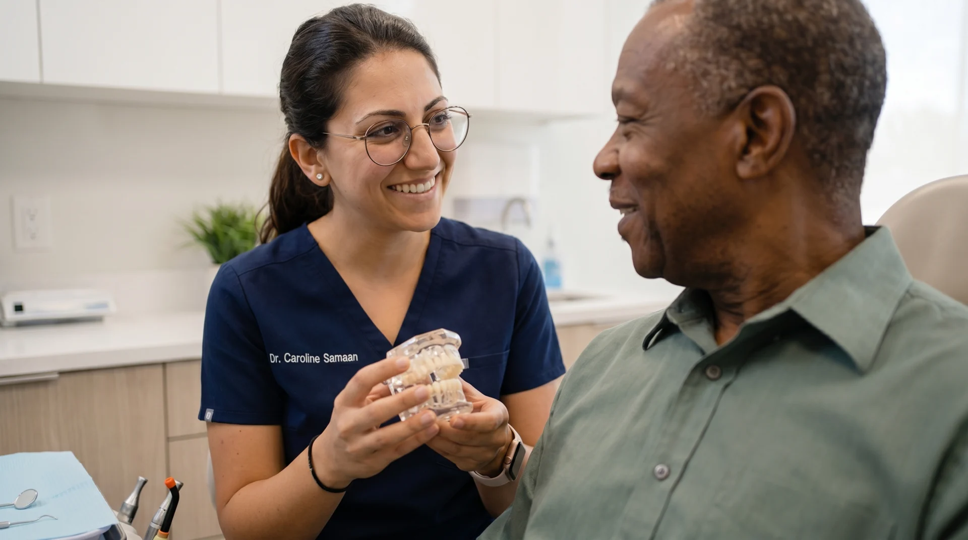 Dr Caroline Samaan showing model to patient