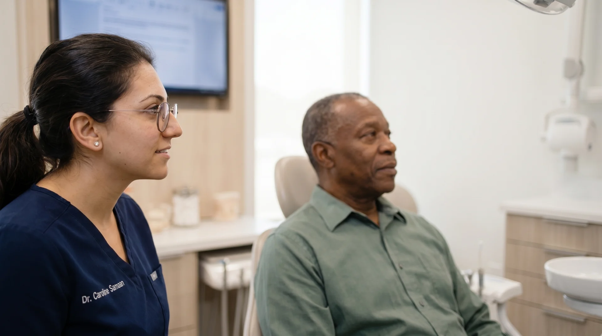 Dr Caroline Samaan consulting with patient in office