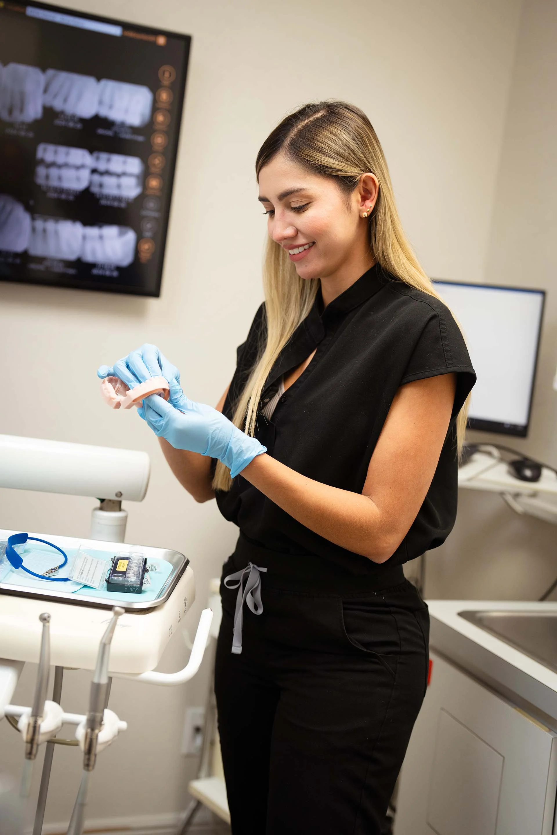 Dr Karen Giraldo showing how implants work in Boca Raton SEDA Dental