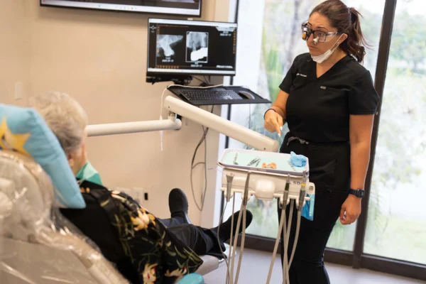 Dentist consulting with patient in SEDA Dental