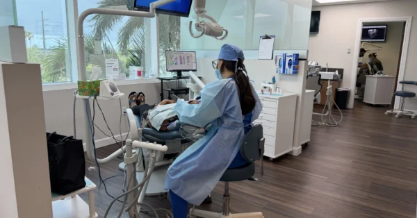 Dental office with patient and dentist