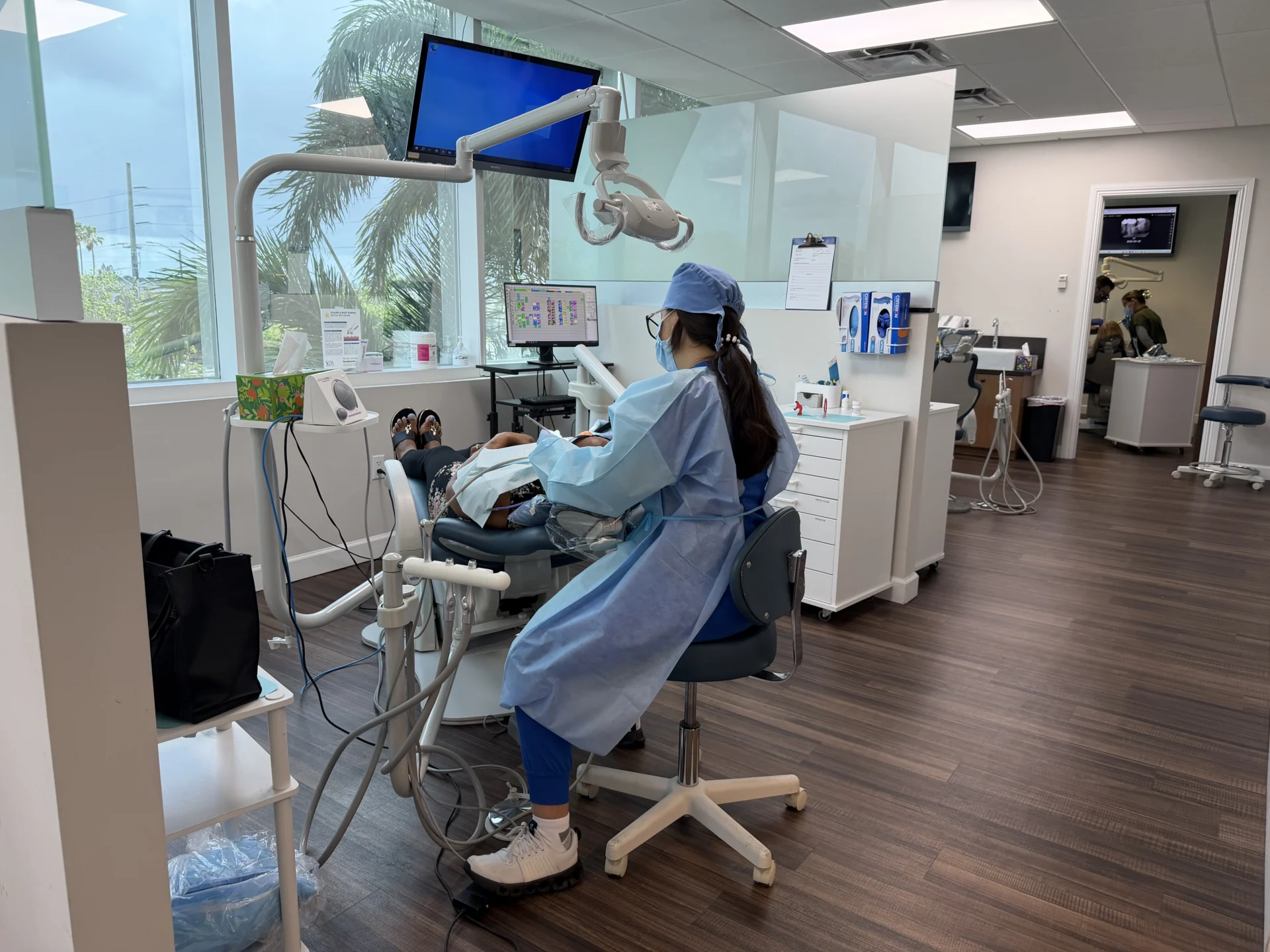 Dental office with patient and dentist