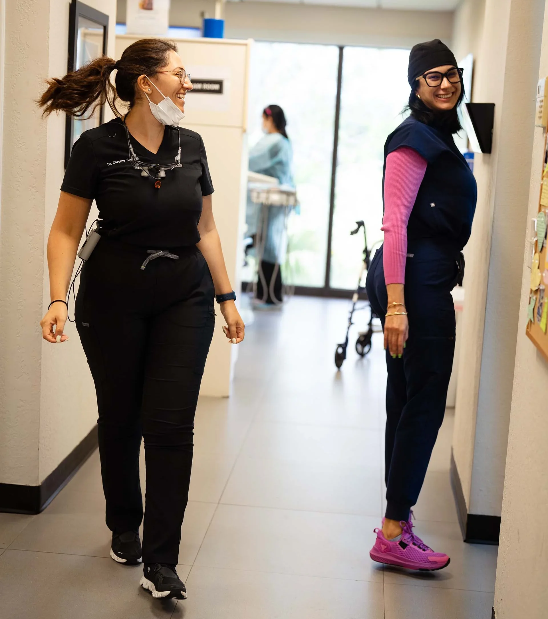 Dr Caroline Samaan and Yanet smiling in the halls of Seda Dental